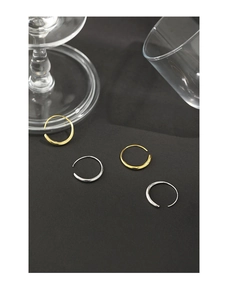 Detailed view of minimalist gold and silver S925 sterling silver C-shaped hoop earrings