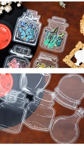 Macro view of transparent PET butterfly and glass bottle stickers for DIY crafting