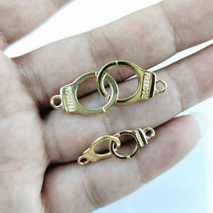 Golden alloy handcuff charms for DIY bracelets with Freedom engraving in hand