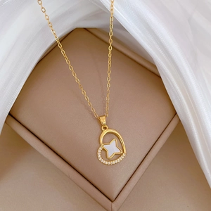 Elegant gold heart pendant necklace with mother of pearl star and zircon accents