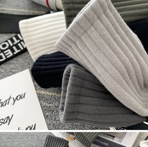 Close-up of assorted ribbed cotton athletic socks in gray, black, white and olive green