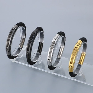 Men's braided bracelets with steel cable accents in black, silver, and gold finishes