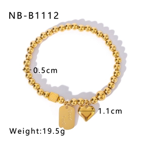 Detailed gold beaded bracelet with Good Luck charm, smiley cube, and heart pendant size guide