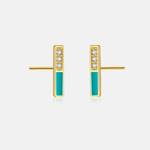 Detail view of S925 silver gold earrings with zircon stones and turquoise enamel