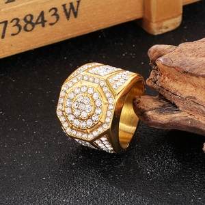 Close-up of luxury gold hip-hop ring featuring dense zircon micro-pave geometric design