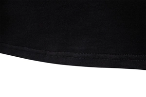 Macro shot of double-needle stitching on the hem of a black cotton V-neck t-shirt