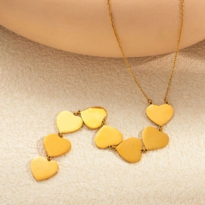Minimalist gold heart choker necklace with seven connected heart-shaped pendants