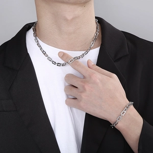Punk style stainless steel chain necklace and bracelet set with OT buckle on male model