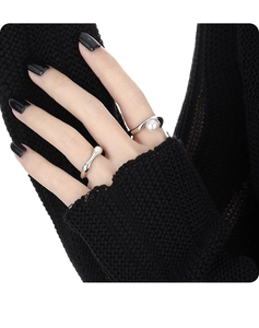 Detail of S925 sterling silver geometric rings with white pearls on female model