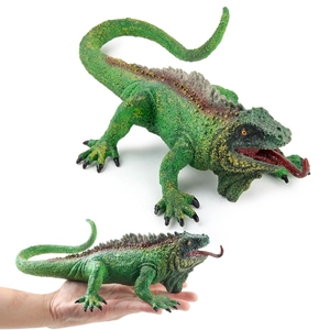 Realistic green iguana lizard model toy with detailed scales and orange eyes