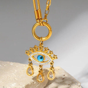 Gold evil eye necklace with blue gemstone, star decor, and teardrop zircon pendants