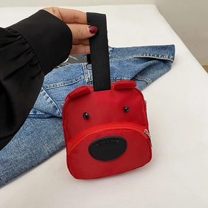 Cute red cartoon bear handbag with black carry handles and 3D ear details for daily use