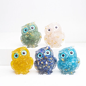 Detailed view of five colorful resin owl figurines with natural crystal stone and gold foil
