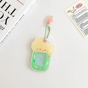 Close-up of cute cartoon acrylic magnetic photo frame keychain with green beaded chain
