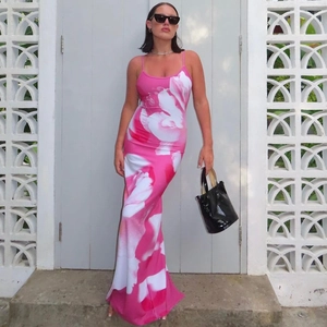 Summer sexy backless slit cami maxi dress with vibrant pink floral print on a model