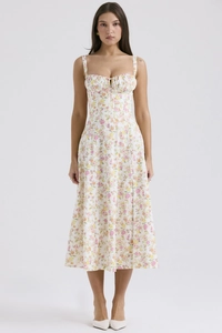 Sweetheart neckline detail on a slim-fit floral midi dress with delicate patterns