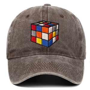 Detail of multi-colored Rubik's cube embroidery on a washed charcoal baseball cap