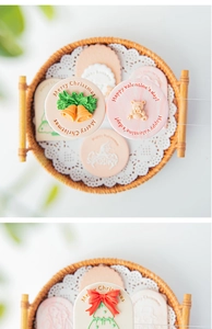 Close-up of pink and beige embossed fondant stamps for Christmas and holiday baking