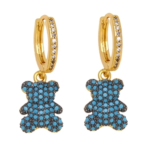 Detail of gold bear earrings with blue turquoise beads and micro-set zircon crystals