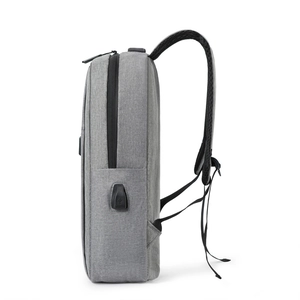 Grey minimalist backpack with USB port and large capacity for travel and laptops