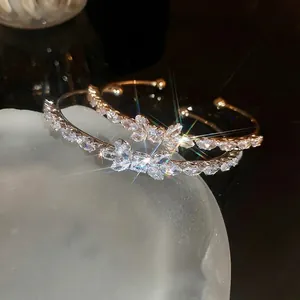 Elegant zircon bow open bangle in rose gold finish with sparkling marquise stones