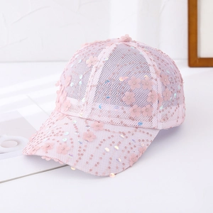 Close-up of pink mesh baseball cap with 3D floral appliqués and shimmering sequins