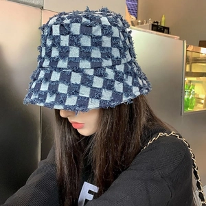 Street style denim bucket hat with blue and white checkered pattern and frayed edges