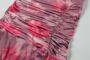 Detailed view of floral print fabric featuring ruched side seams and mesh texture