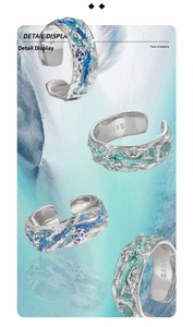 Close-up of S925 sterling silver rings with blue enamel and textured finish details