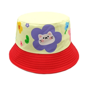 Detail of color-block kids bucket hat with cartoon cat pattern and wide red sun brim