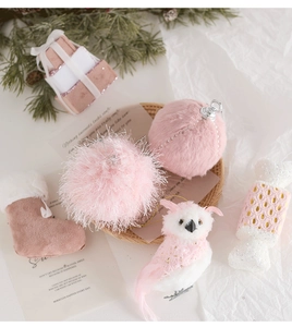 Pink and white Christmas ornament set featuring plush balls, owl, and gift box decorations