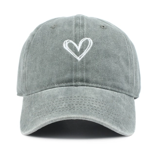 Detailed front view of washed grey baseball cap with white heart embroidery