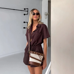 Deep brown short sleeve waist-tie romper with collar and matching canvas bucket bag