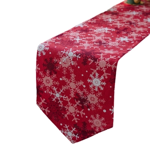 Red Christmas table runner with white snowflake prints for festive home decoration