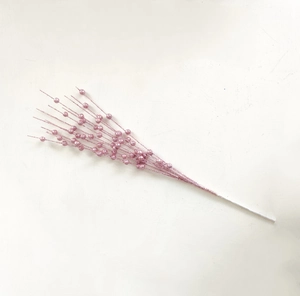 Close-up of pink glitter artificial berry stems for Christmas tree decorations