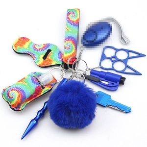 Detailed close-up of blue tie-dye neoprene safety keychain accessories and tools