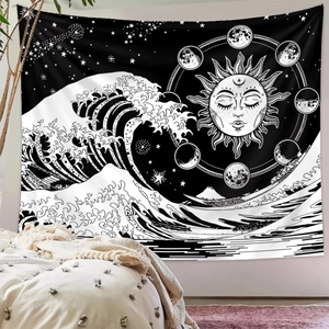 Detail of black and white sun and moon tapestry with wave and mountain pattern