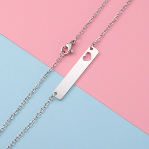 Polished silver bar pendant necklace with hollow heart cutout and delicate link chain