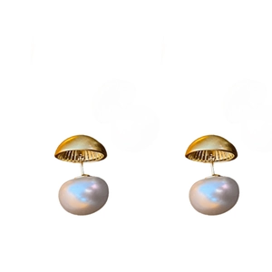 Minimalist gold hoop earrings with white baroque pearls shown on a clean white background