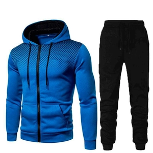 Detail of blue zip-up hoodie with black gradient dot print on shoulders and sport pants