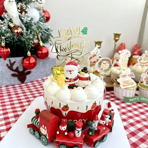 Christmas cake decoration set with Santa Claus, snowman figures and golden Merry Christmas sign