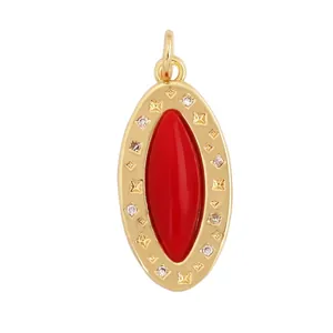 Detail view of gold oval pendant with red stone, star engraving and dimensions