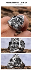 Macro shot of stainless steel skull ring with vintage mandala floral engraving patterns