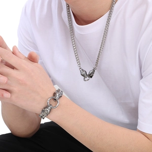 Detailed close-up of 6mm stainless steel dragon head chain necklace and bracelet set