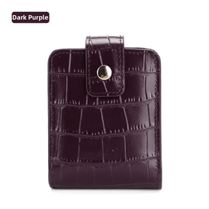 Detail of dark purple crocodile texture PU leather lipstick pouch with gold buckle and mirror