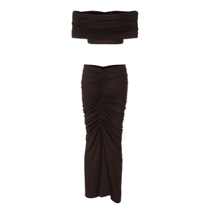 Detail of coffee brown two-piece set featuring off-shoulder top and pleated maxi skirt