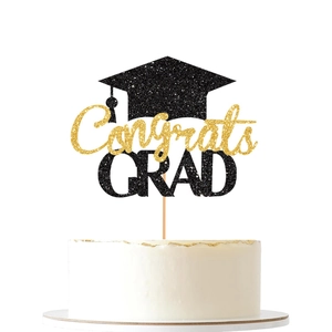 Glittering black and gold Congrats GRAD cake topper featuring a graduation cap design