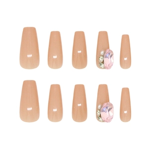 Pink coffin press-on nails with large heart rhinestones and sparkling pearl accents
