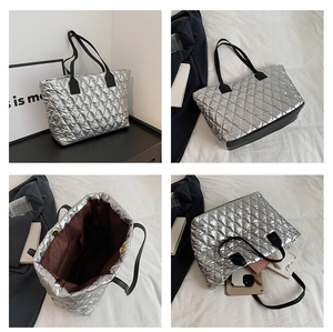 Detailed views of a silver quilted tote bag with black straps and spacious brown interior