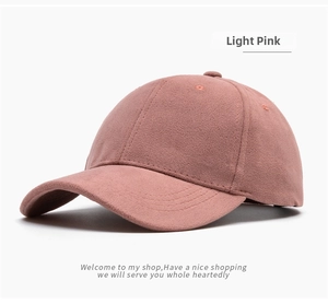 Detailed view of light pink faux suede baseball cap showing fabric texture and stitching